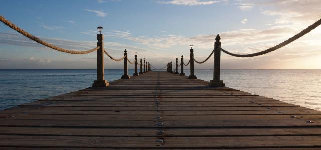 Pier over sea against sky